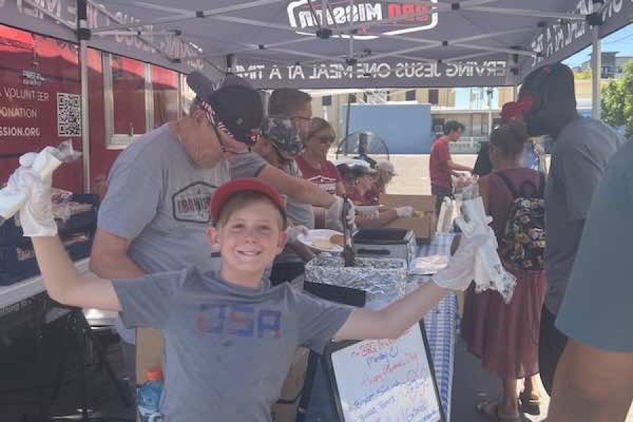 Volunteers young boy volunteering at table